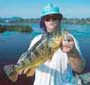Greg Sargent<BR>holds a nice<BR>Peacock Bass
